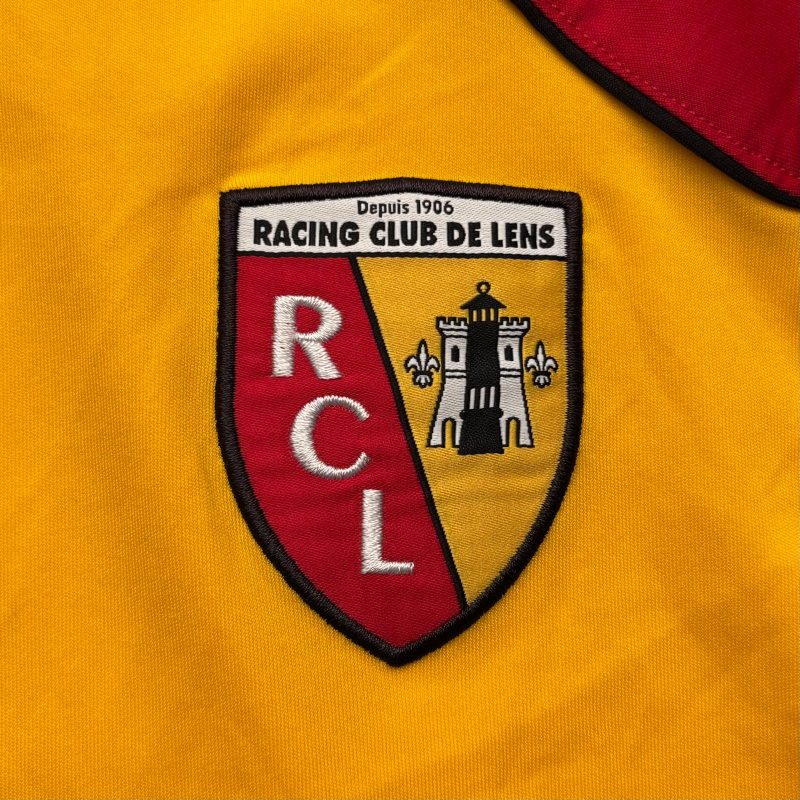 rc-lens-reebok-home-jersey-2010-2011-crest